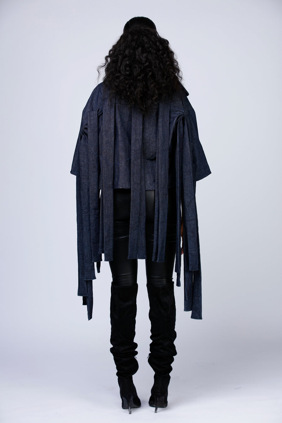 Dark blue denim jacket with fringes. Backview.